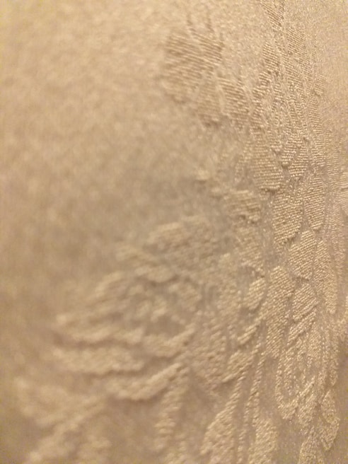 A close-up of soft fabric textures in various patterns.
