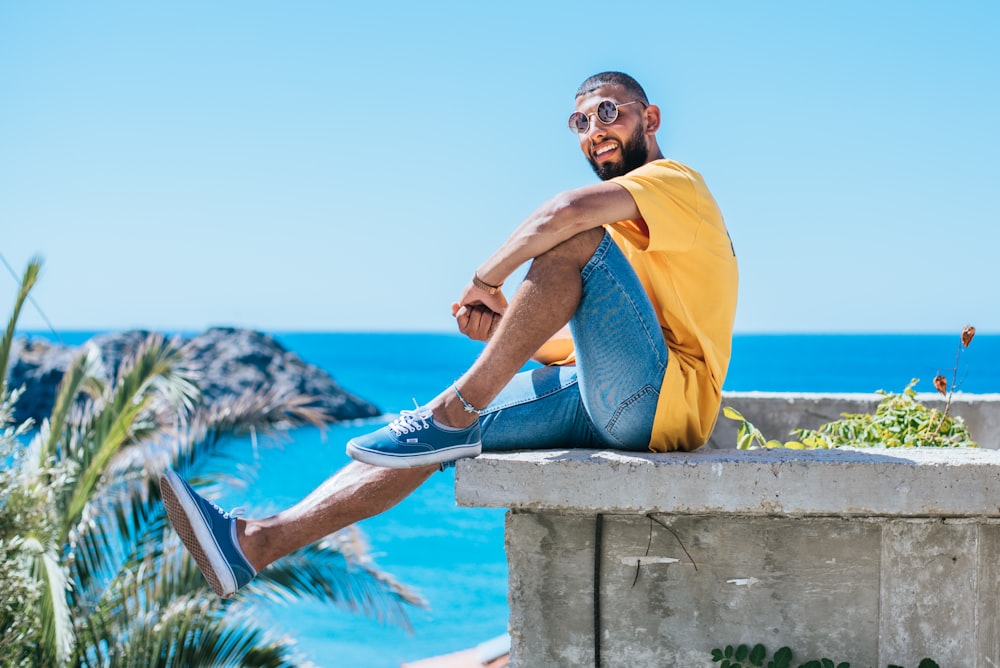 man wearing yellow crew-neck shirt