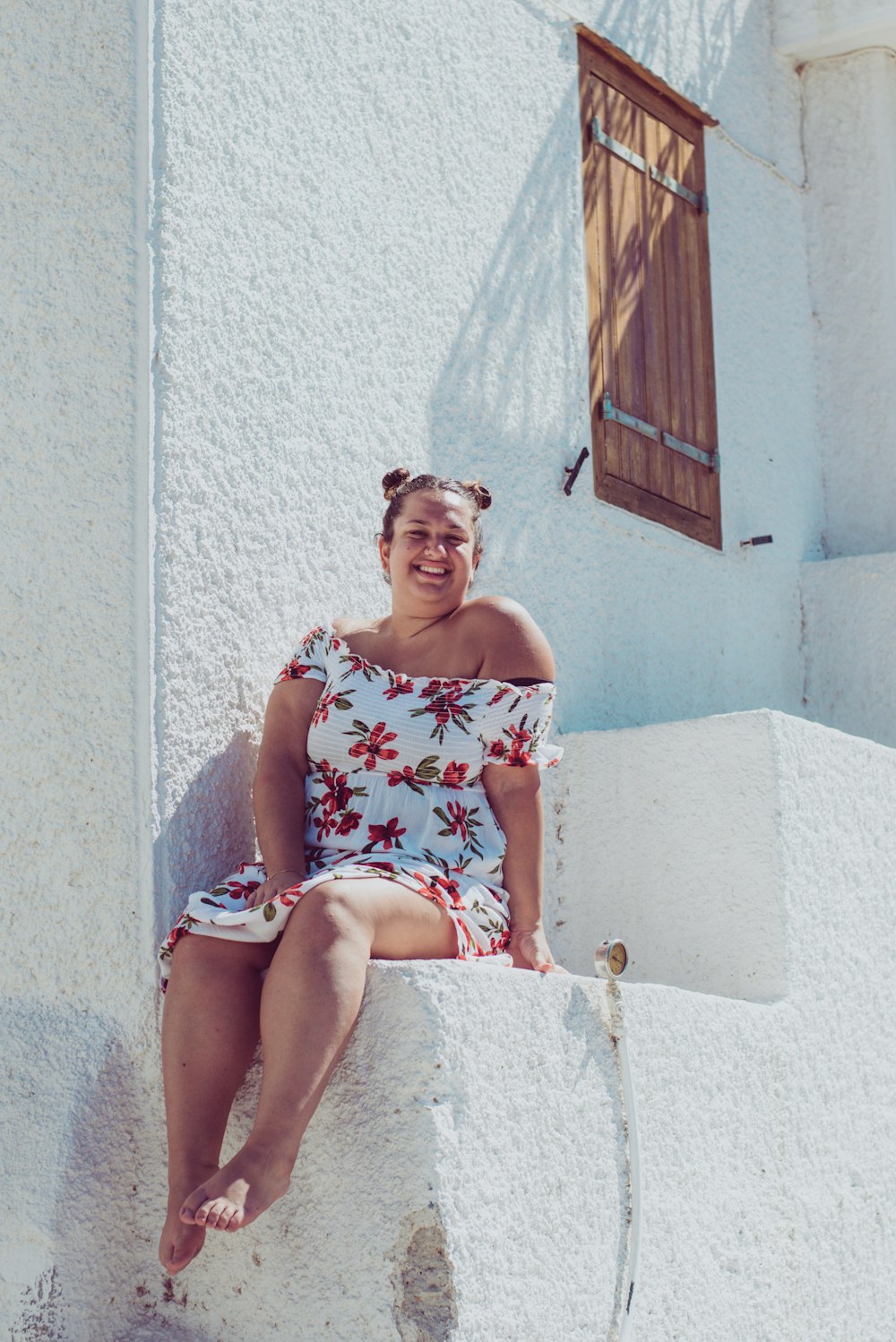 woman sitting on stairs during daytime