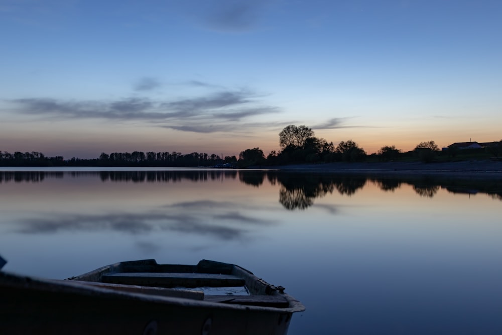 boat on body of water near trees