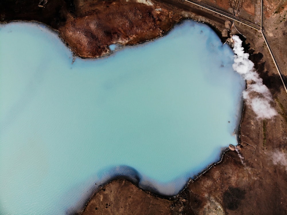 aerial photography of mountain and body of water