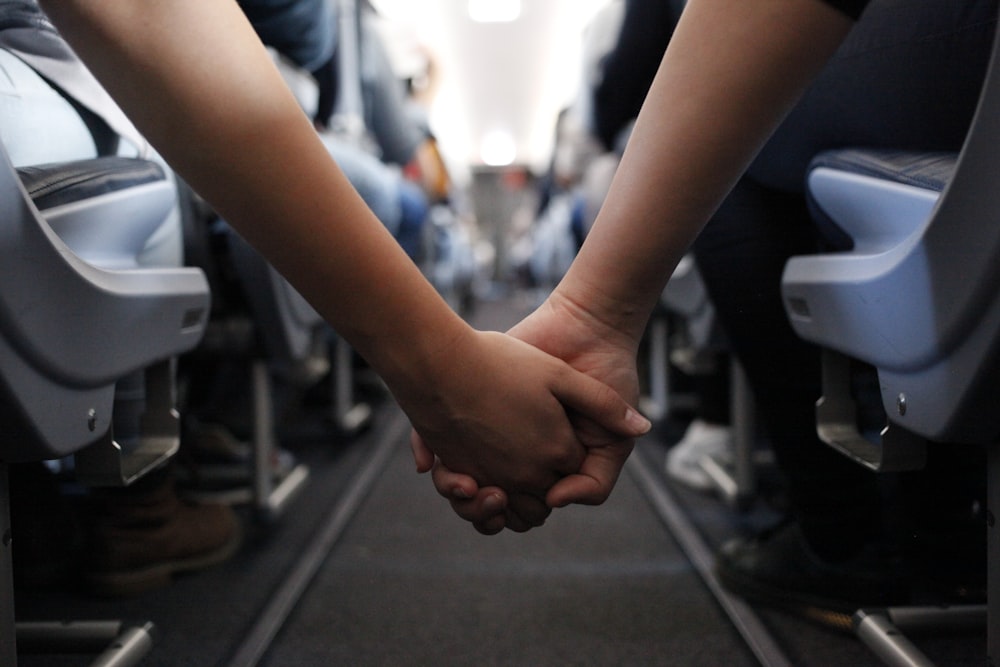 two hand holding close-up photography