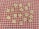 Scrabble tiles are scattered on a red and white checkered background. The tiles display various letters randomly placed across the surface.