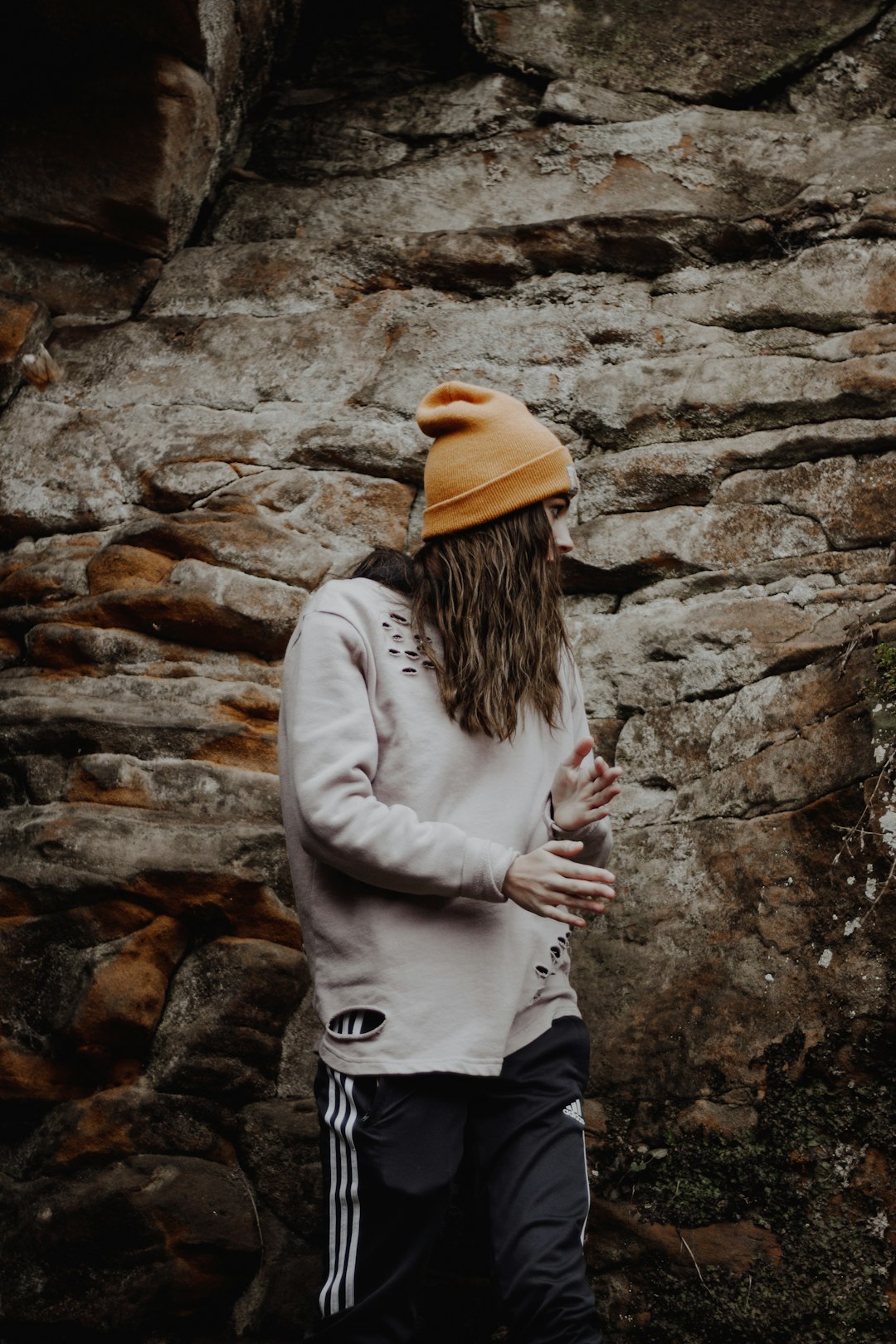 man standing wearing white sweater