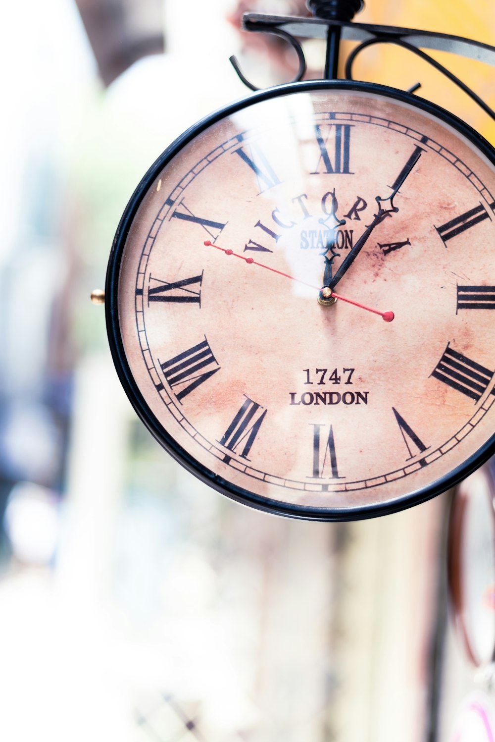 black and brown analog street clock