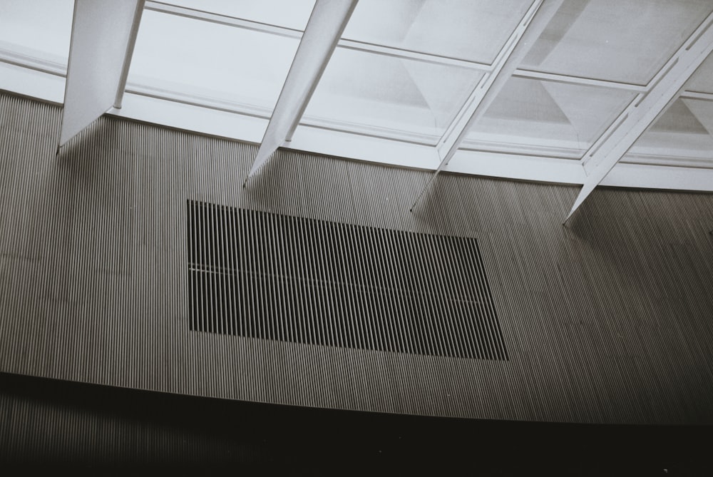 a black and white photo of a floor with a grate