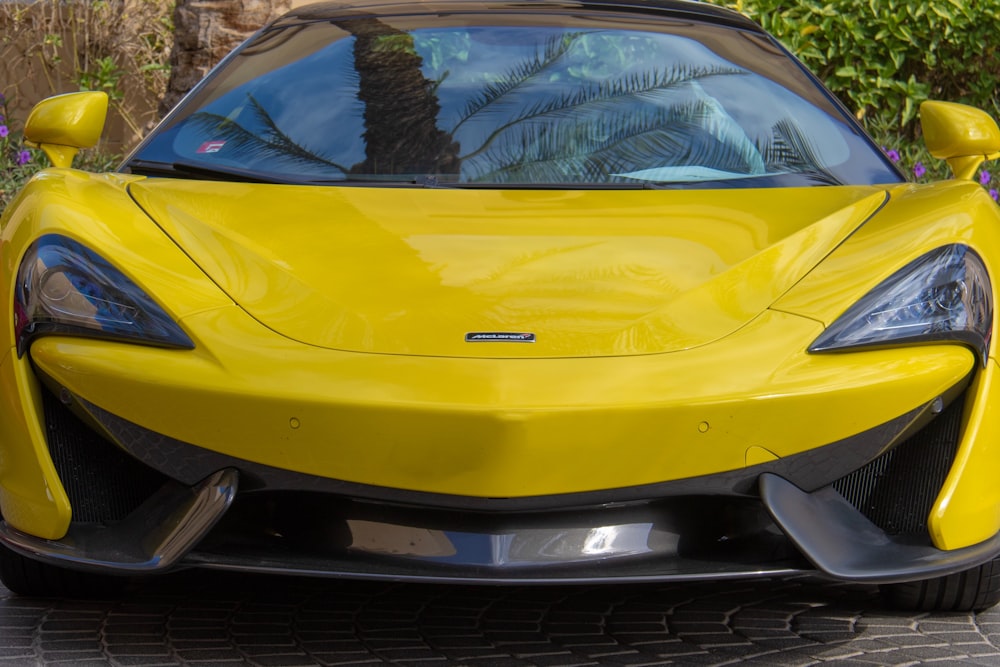 yellow vehicle on focus photography