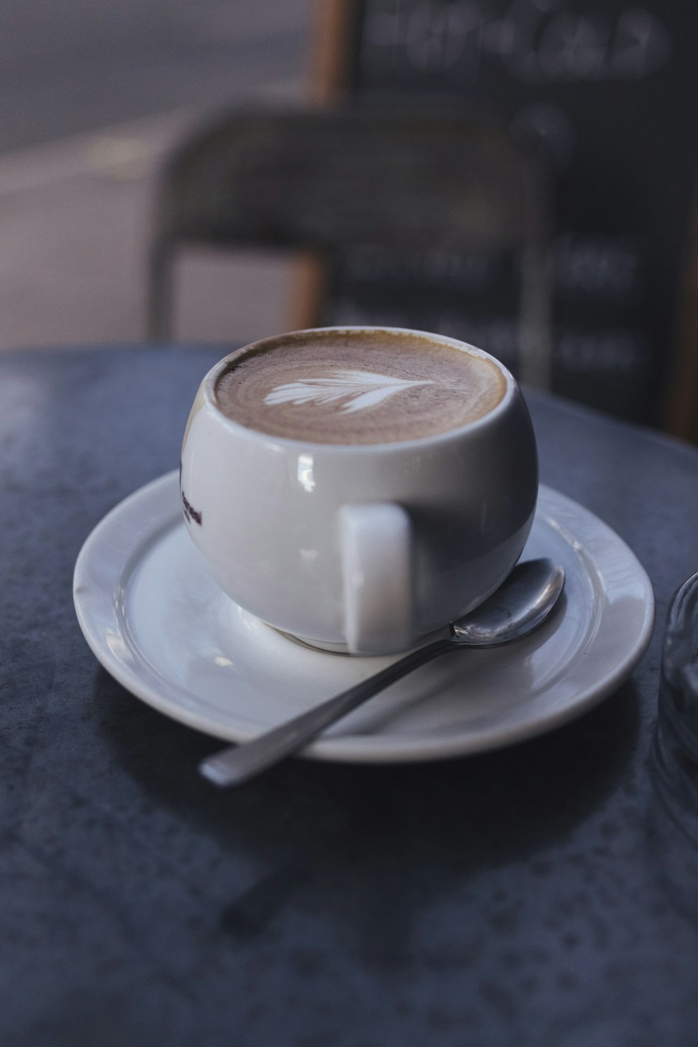 white ceramic mug on saucer