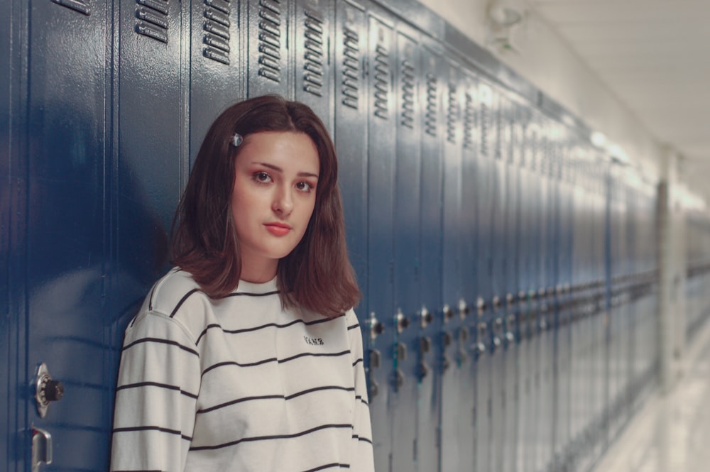 woman leaning against locker