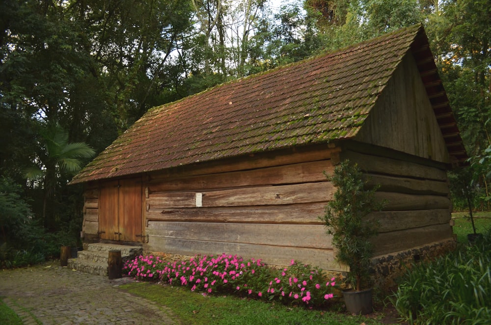 brown wooden house near tree