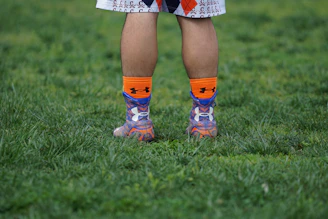 Athletes wearing vibrant sports socks during a run.