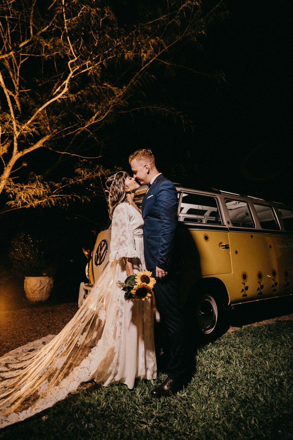 couple kissing near the van