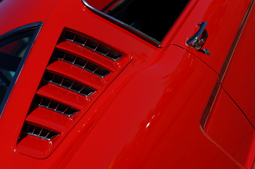 closeup photo of red vehicle