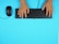 Hands typing on a keyboard with colorful digital workflow icons floating above.
