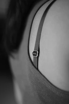 a close up of a person wearing a bra