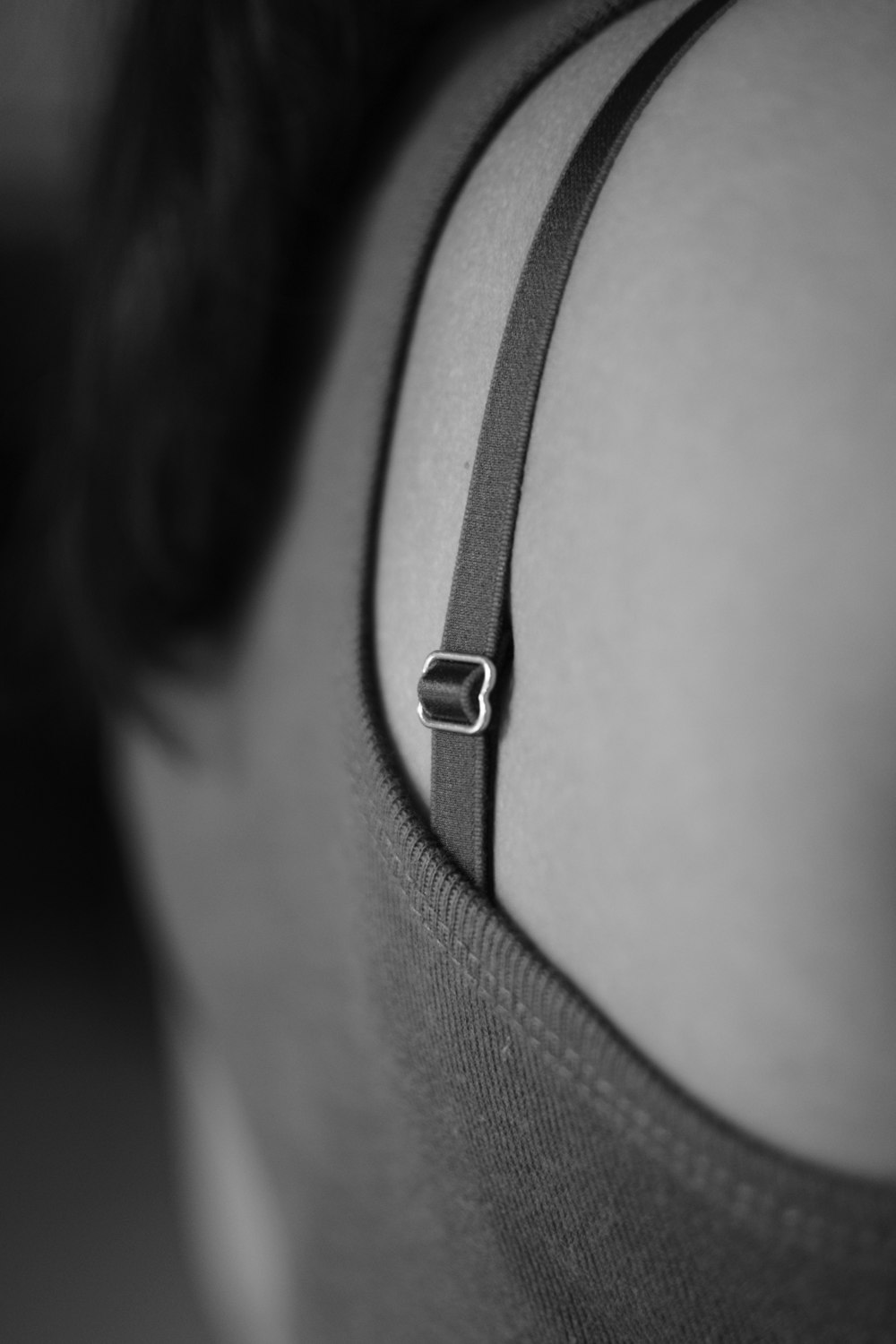 A close up of a person wearing a bra photo – Free Grey Image on
