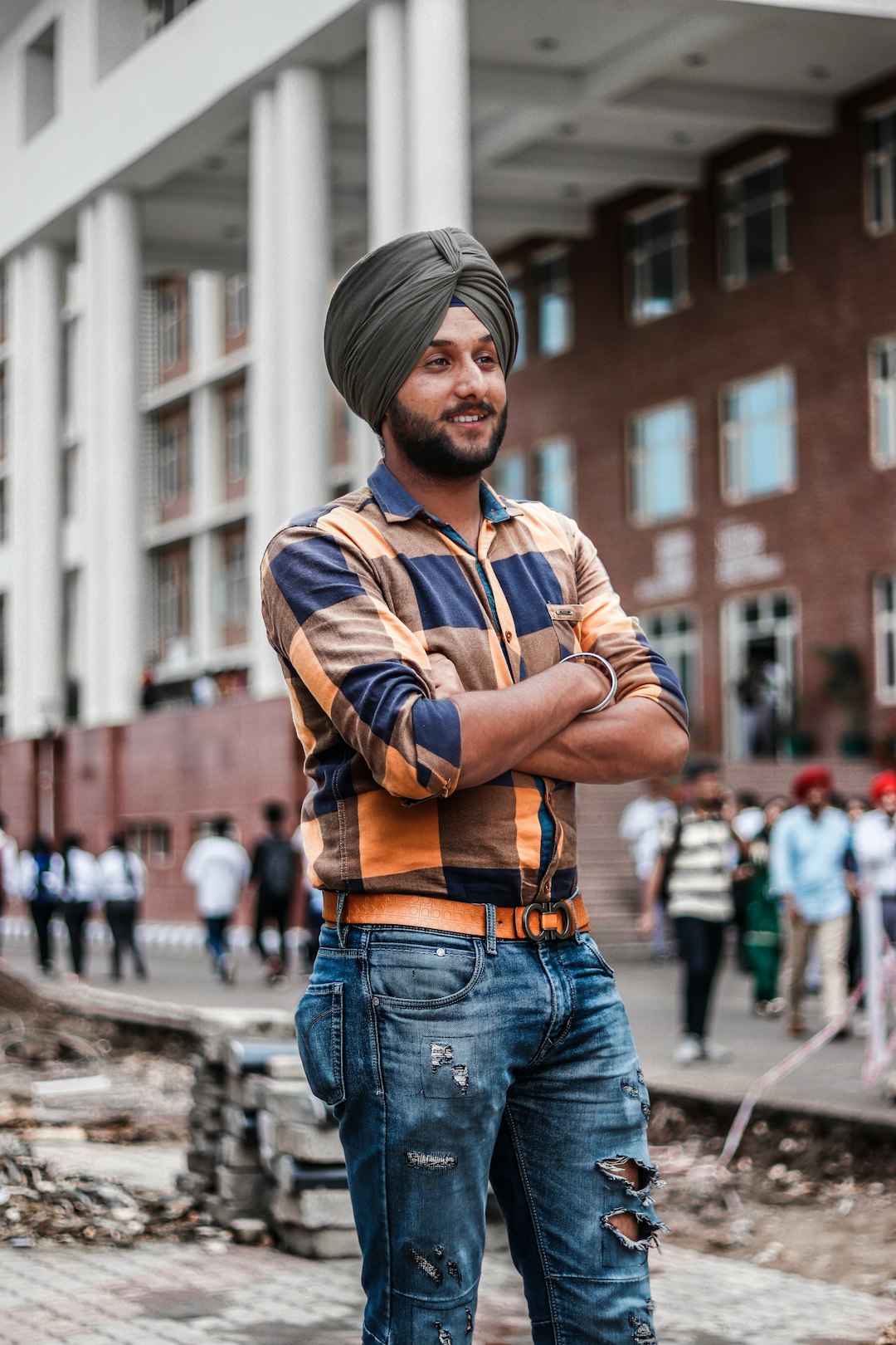 smiling man standing near people