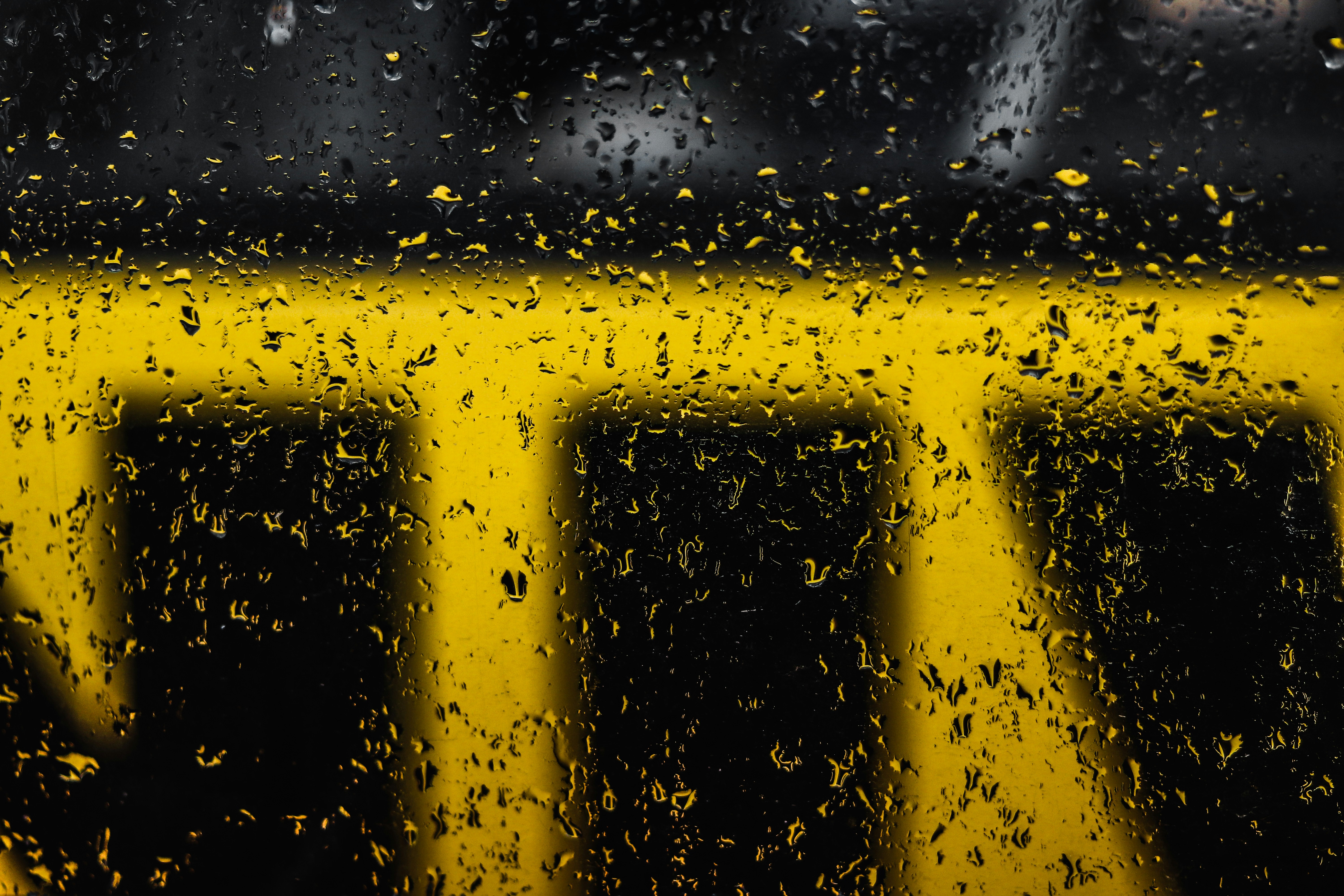 rain drops on the window of a bus