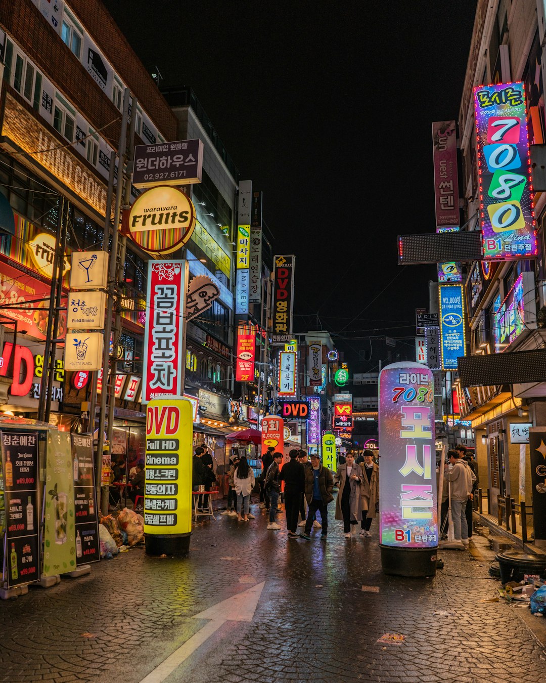 people walking beside stores