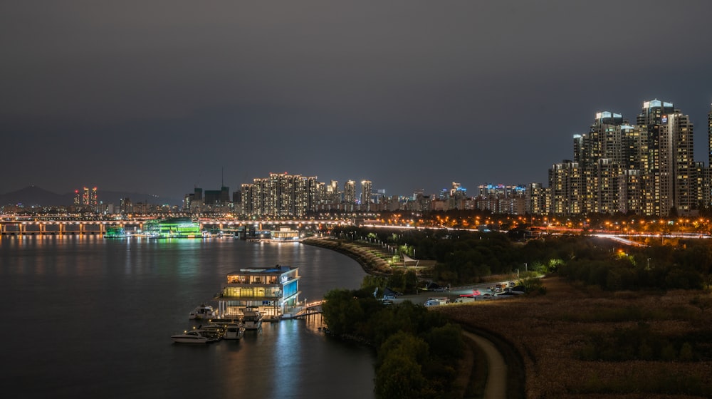 aerial view of building near body of water at nighttime