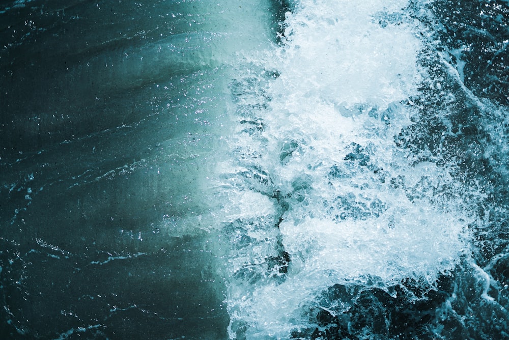 a large body of water surrounded by waves