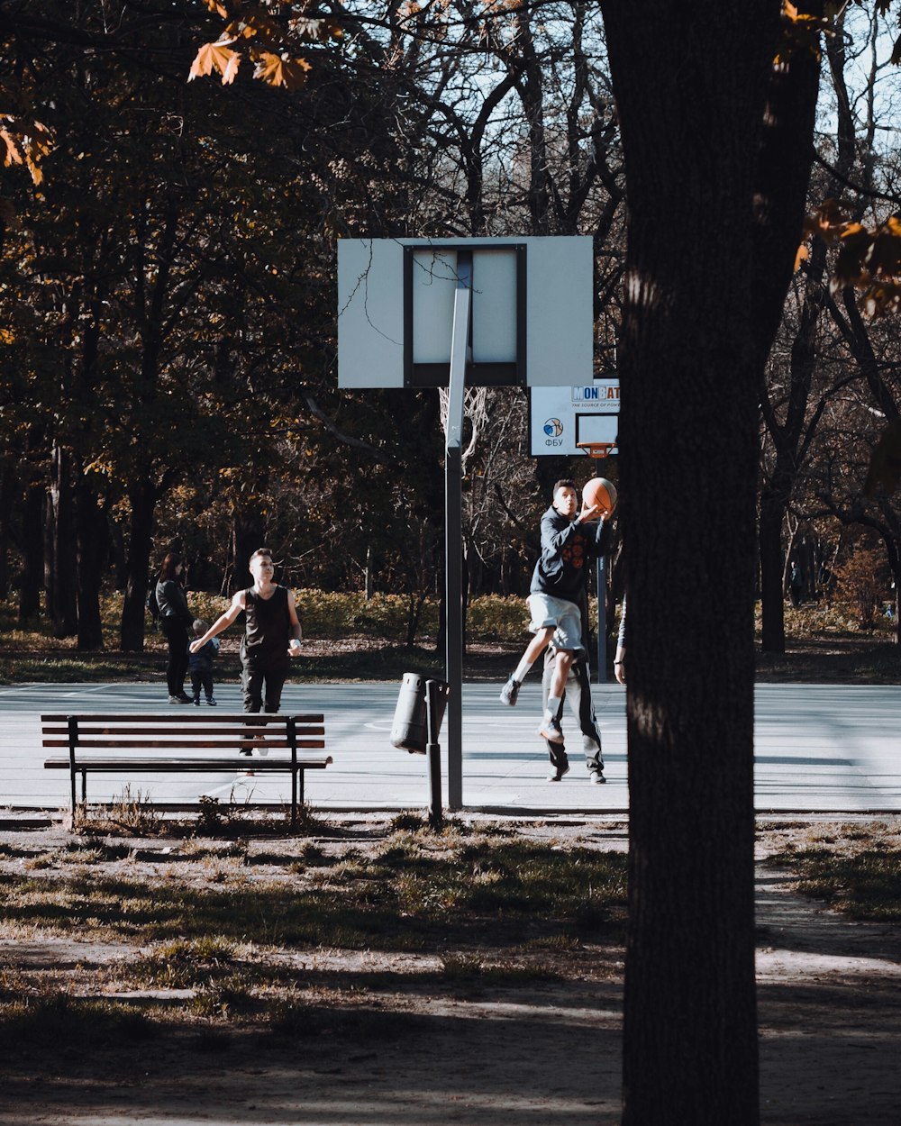 group of person playing basketball