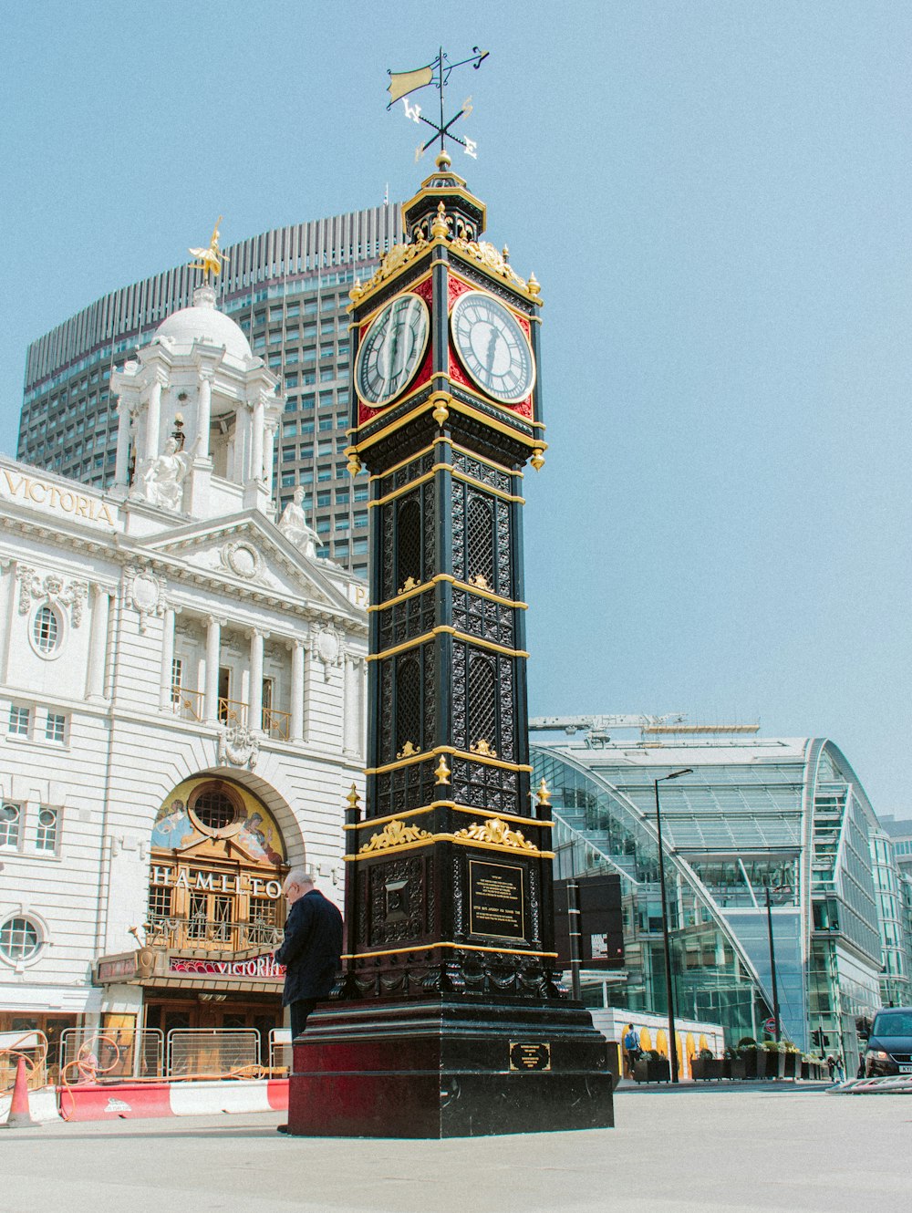 black, brown, and red clock tower