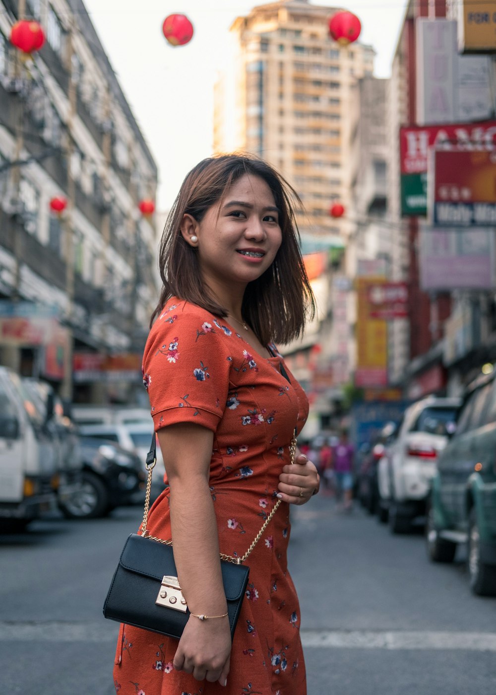 woman standing on road on selective focus photography