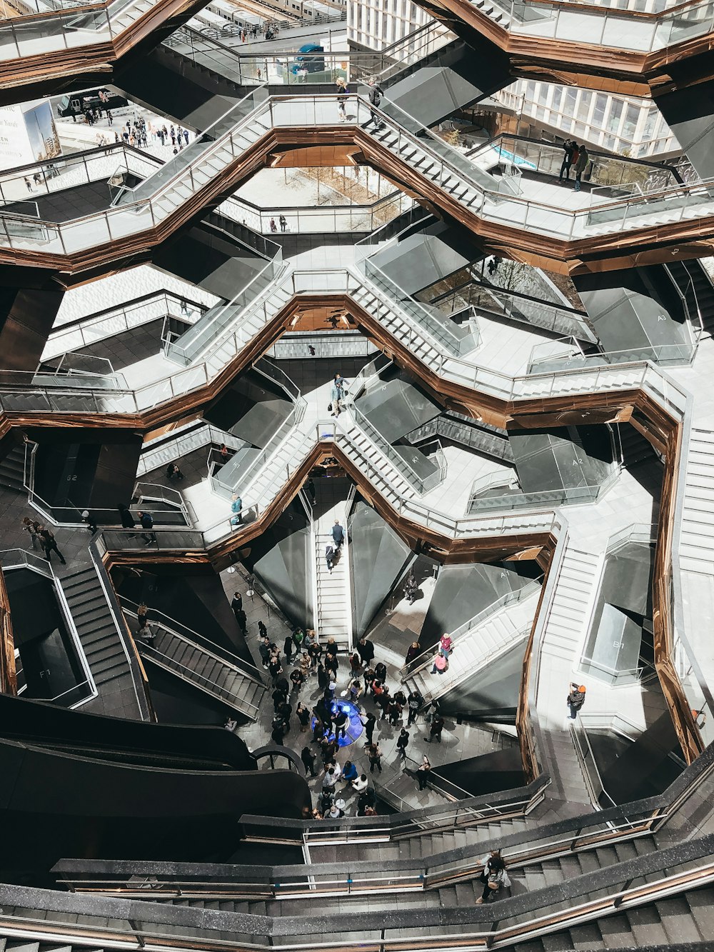 a group of people walking up and down some stairs