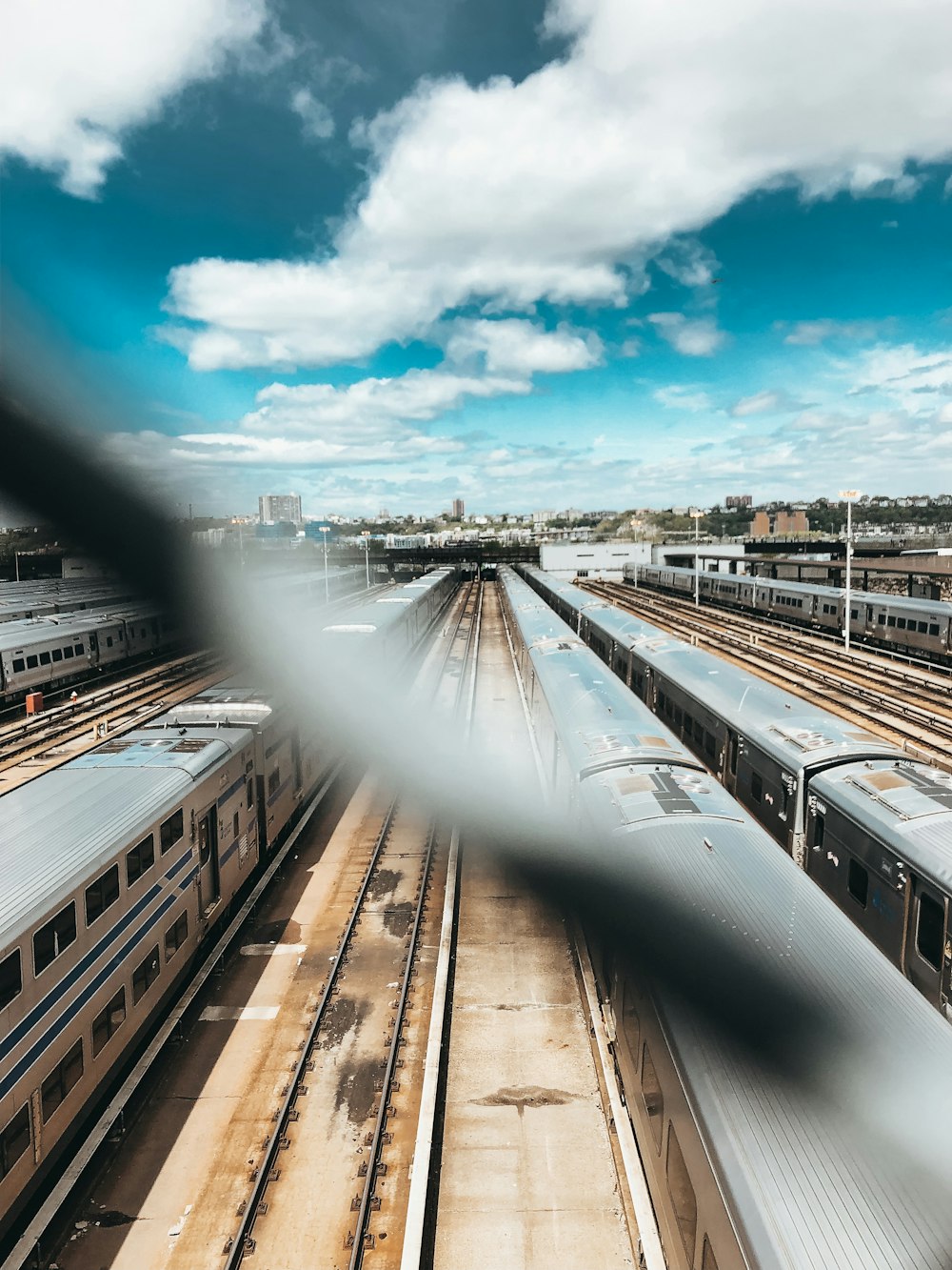 gray trains under blue sky