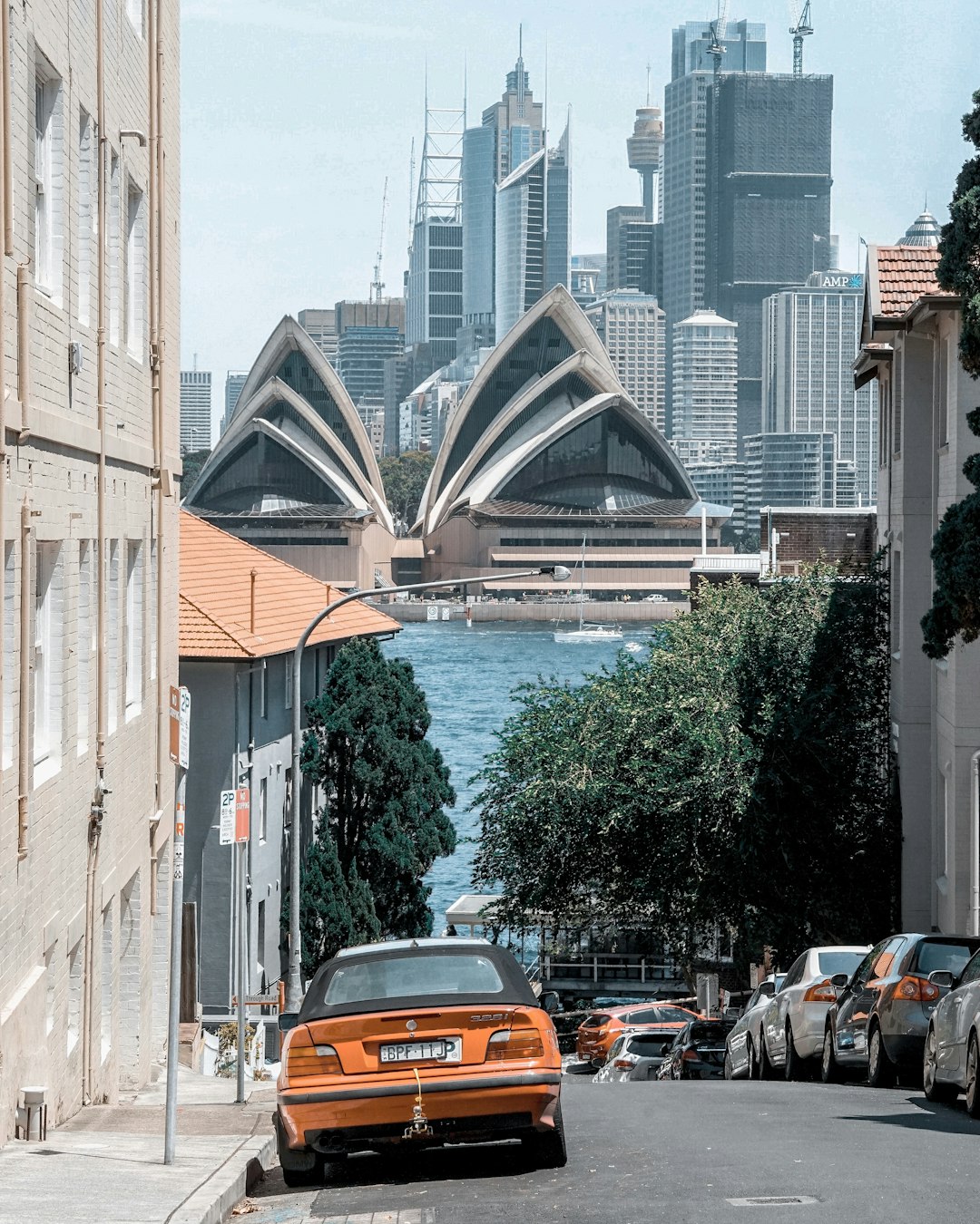 yellow vehicle parked beside building