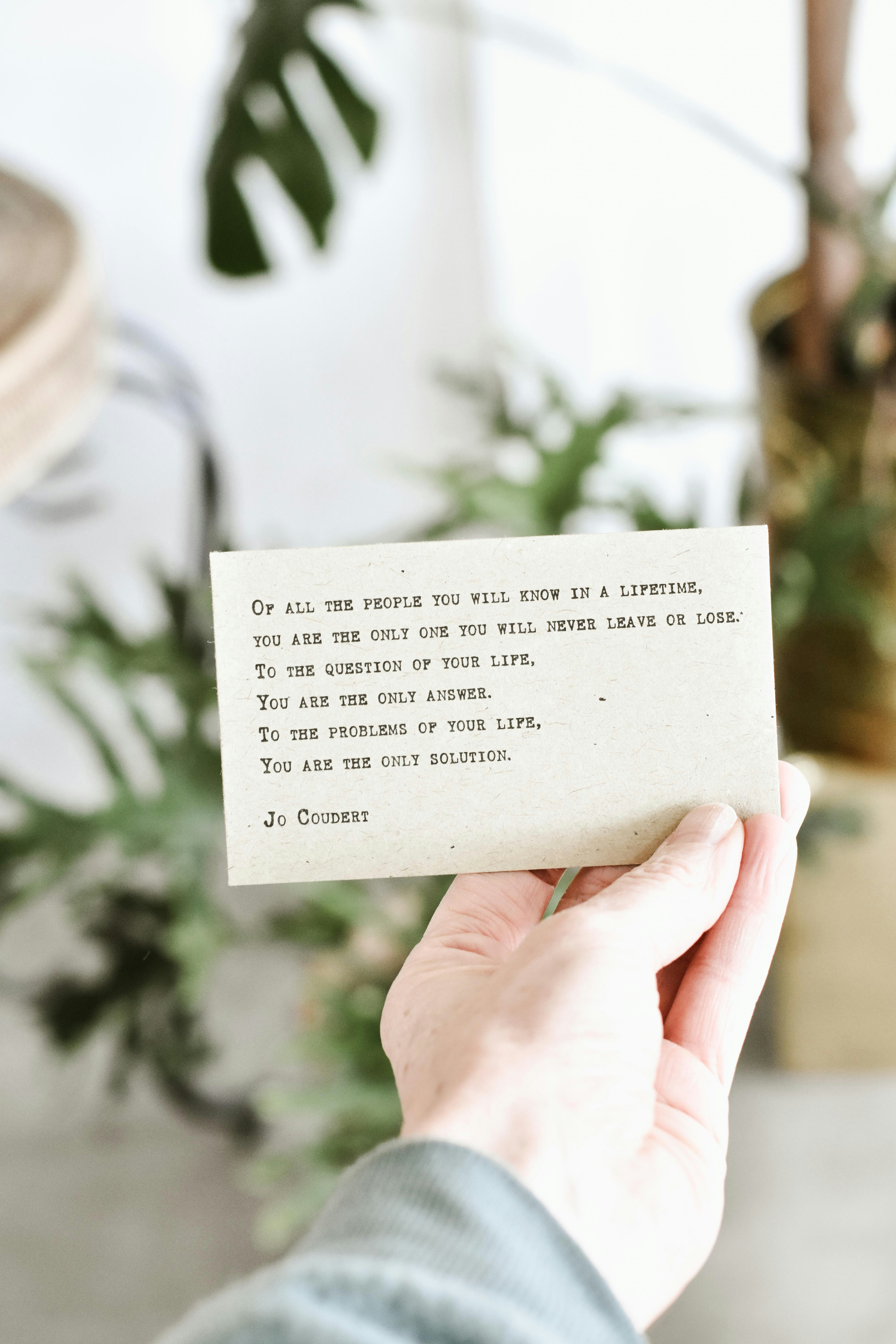 person holding quote card