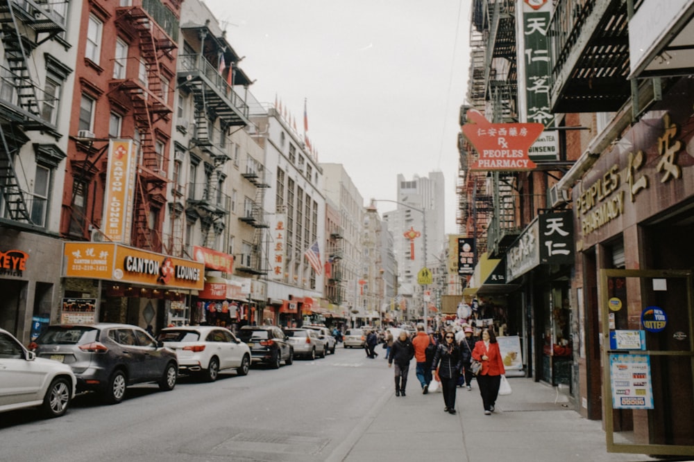 people walking on side walk during daytime