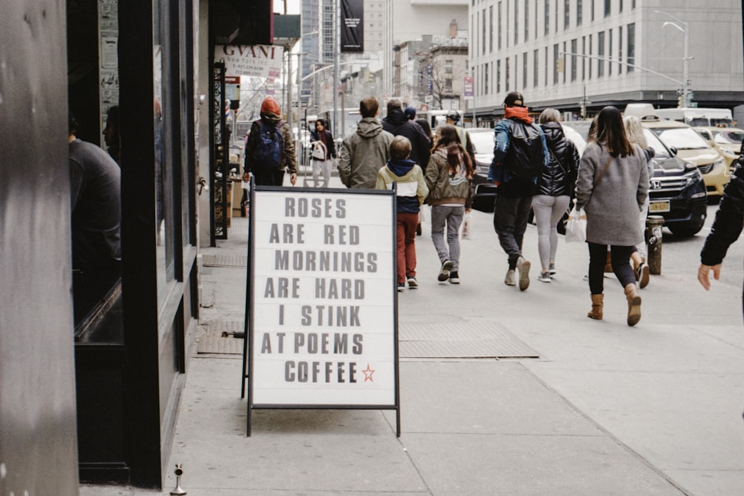 people walking on side walks during daytime