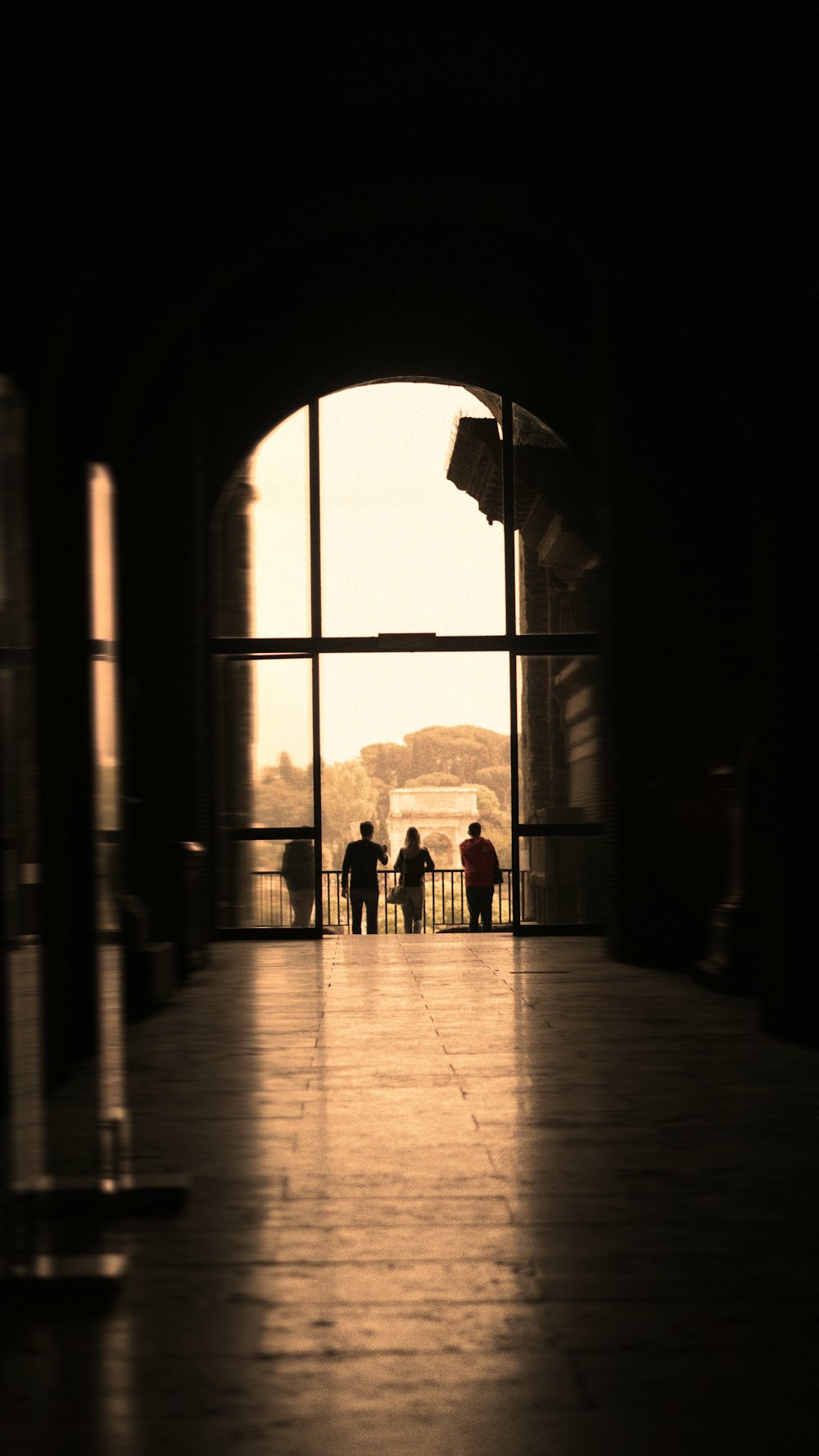 silhouette of people walking on hall