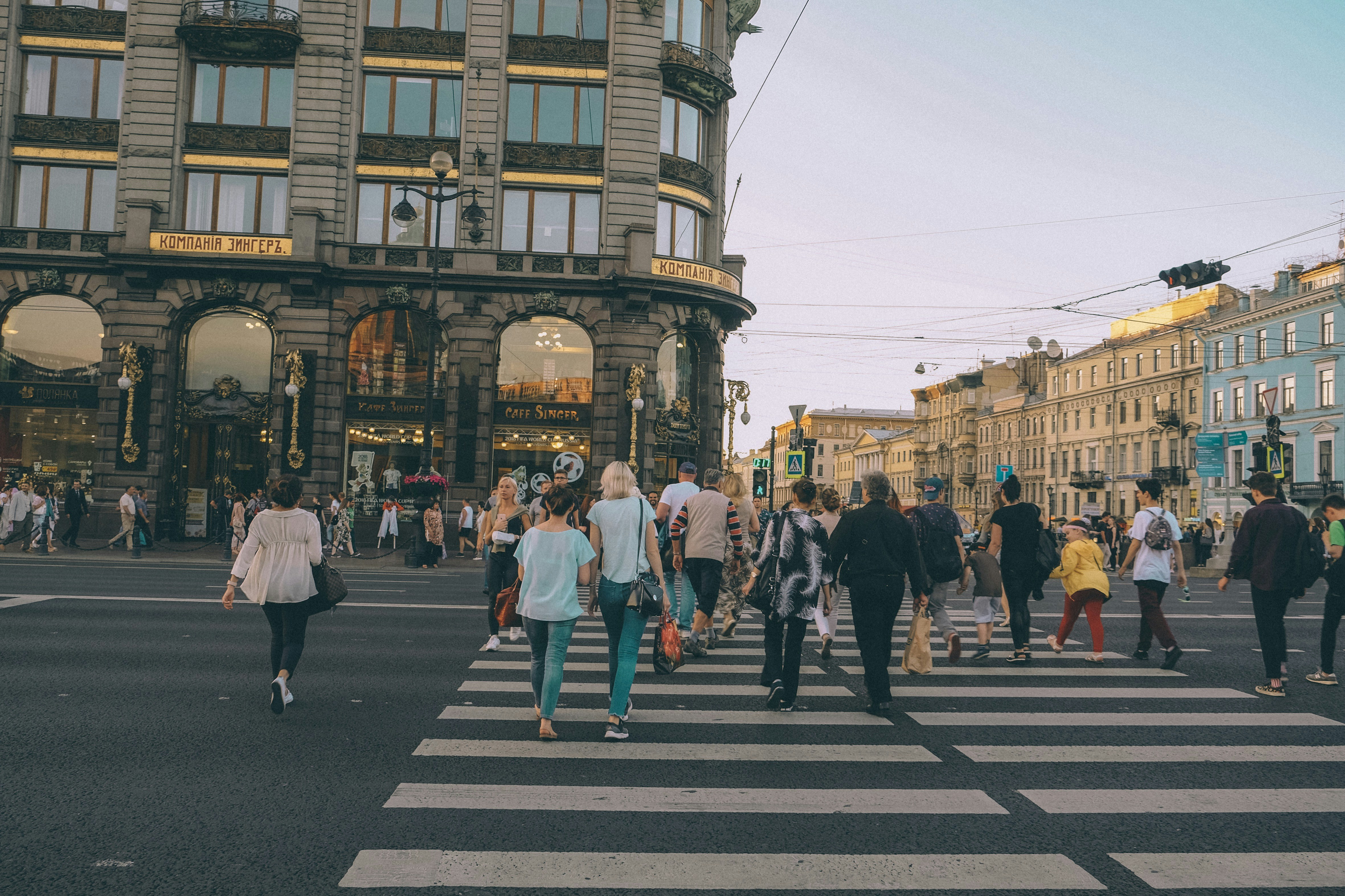 people crossing in pedestrian lane
