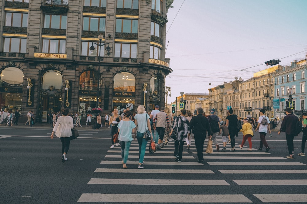 people crossing in pedestrian lane