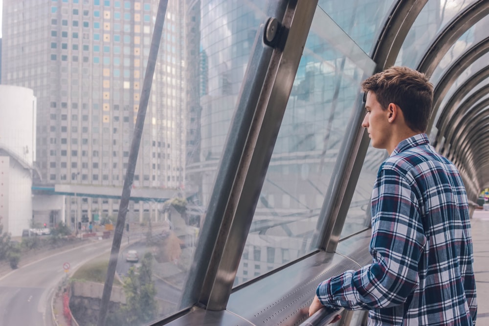 man standing near window