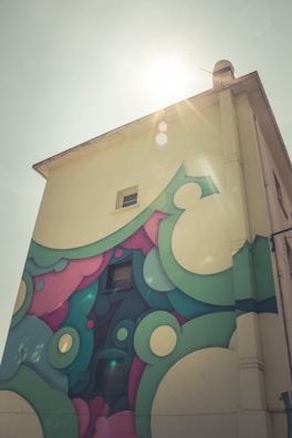 Close-up of a vibrant exterior wall with smooth, flawless paint finish under bright sunlight.