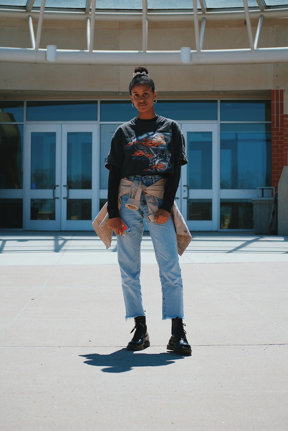 woman standing on pavement