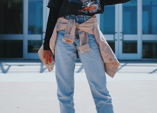 woman standing near building