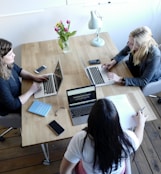 three women sitting and facing each other