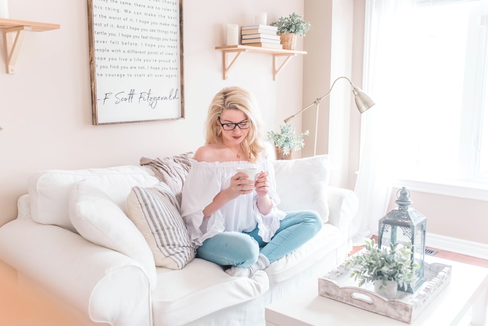 woman sitting on sofa