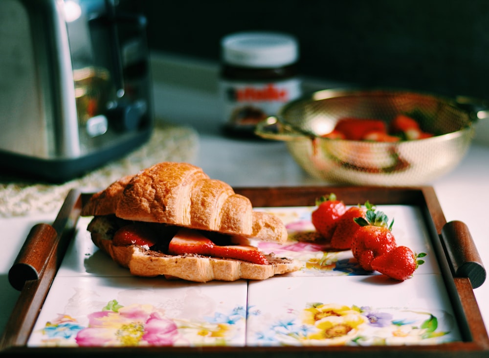 baked bread with sliced strawberries