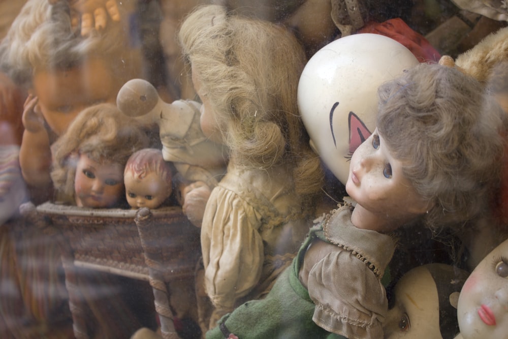 assorted dolls and parts