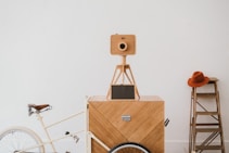 camera on tripod beside bicycle