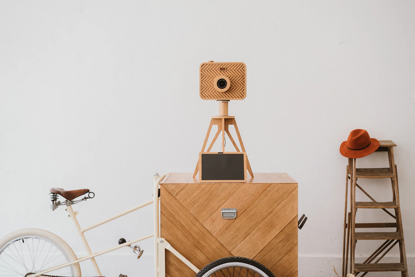 DIY photo booth backdrop for receptions — A couple posing for a photo booth picture at a wedding reception.