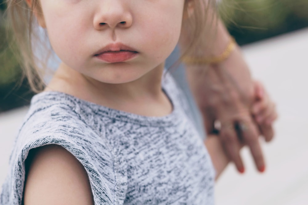 girl holding person's hand