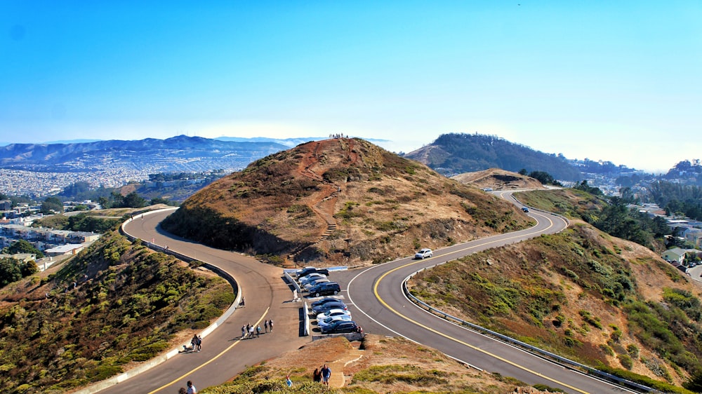 aerial photography of cars parked in the middle of road