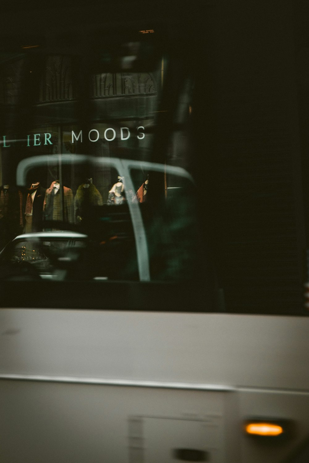 the reflection of a bus in the window